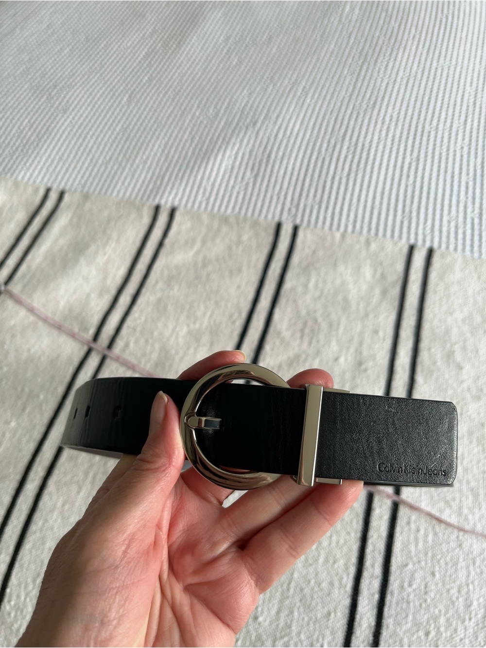 Calvin Klein jeans.  Black Leather Belt with Round Silver Buckle